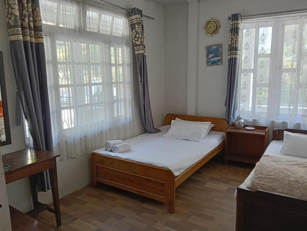 Postel nebo postele na pokoji v ubytování Yuven House