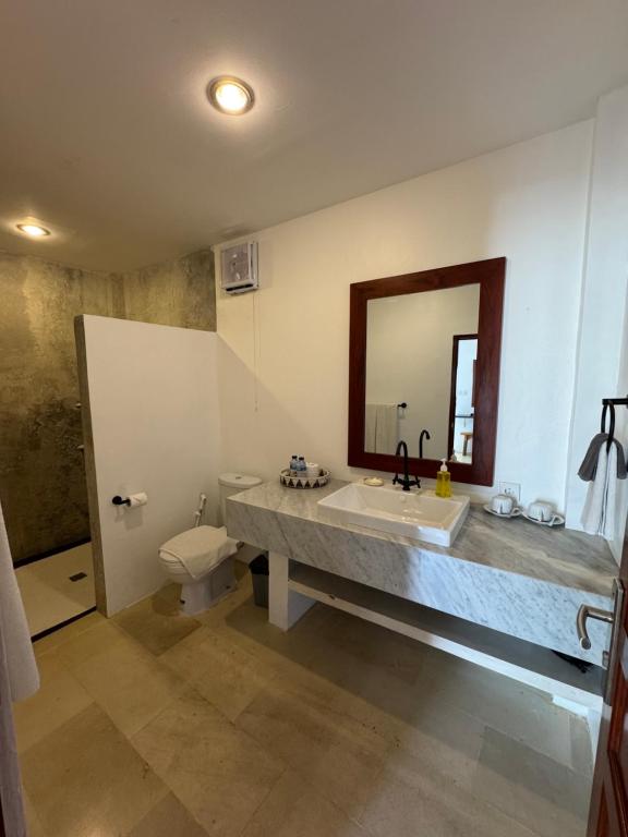 Koupelna v ubytování Uluwatu Stay's Standard Room #4