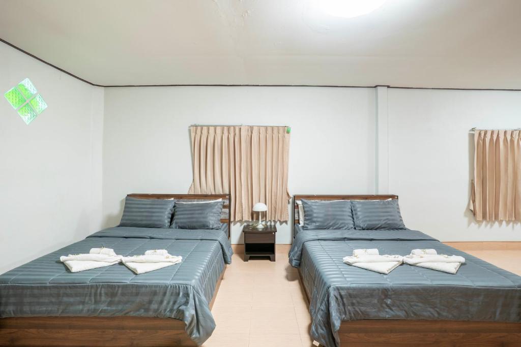 Postel nebo postele na pokoji v ubytování Phumthada Rommanee Krabi Resort