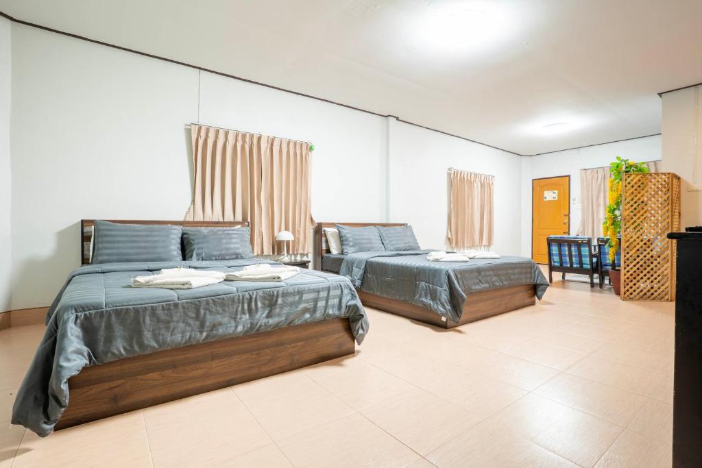 Postel nebo postele na pokoji v ubytování Phumthada Rommanee Krabi Resort