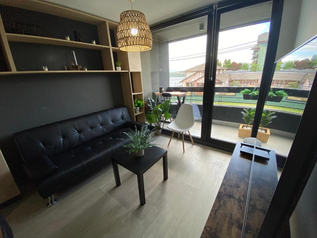 Posezení v ubytování Dpto costero vista al lago, piscina y jacuzzi