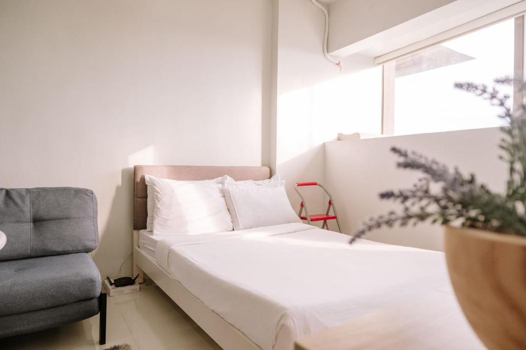 Ένα ή περισσότερα κρεβάτια σε δωμάτιο στο A Minimalist Cozy Escape