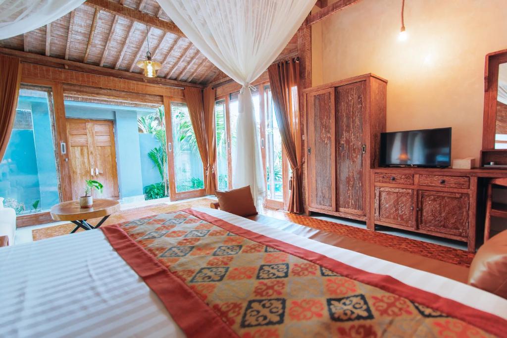 Postel nebo postele na pokoji v ubytování The Bagus Lokha Ubud Villa