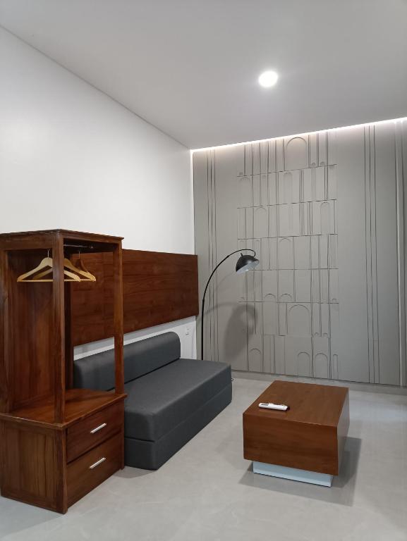 Postel nebo postele na pokoji v ubytování Rauda Living Space Syariah