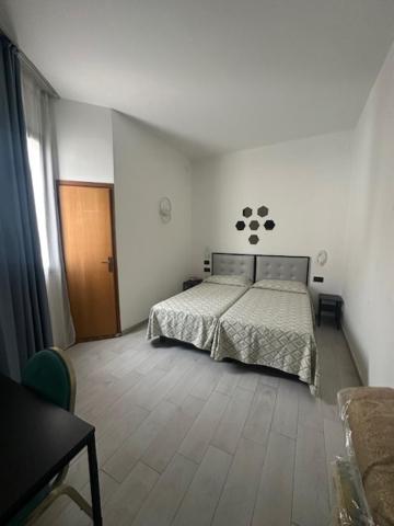 Postel nebo postele na pokoji v ubytování Hotel Europa