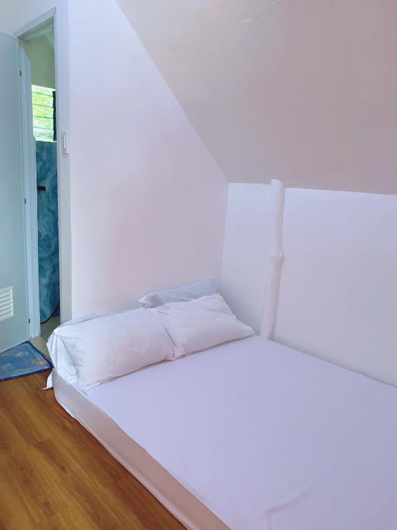 Postel nebo postele na pokoji v ubytování RCM Ecolodge Inn