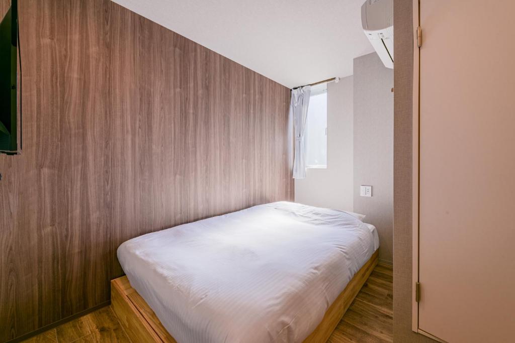 Postel nebo postele na pokoji v ubytování &AND HOSTEL ASAKUSA KAPPABASHI