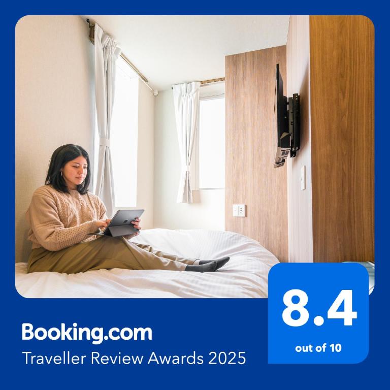 Postel nebo postele na pokoji v ubytování &AND HOSTEL ASAKUSA KAPPABASHI