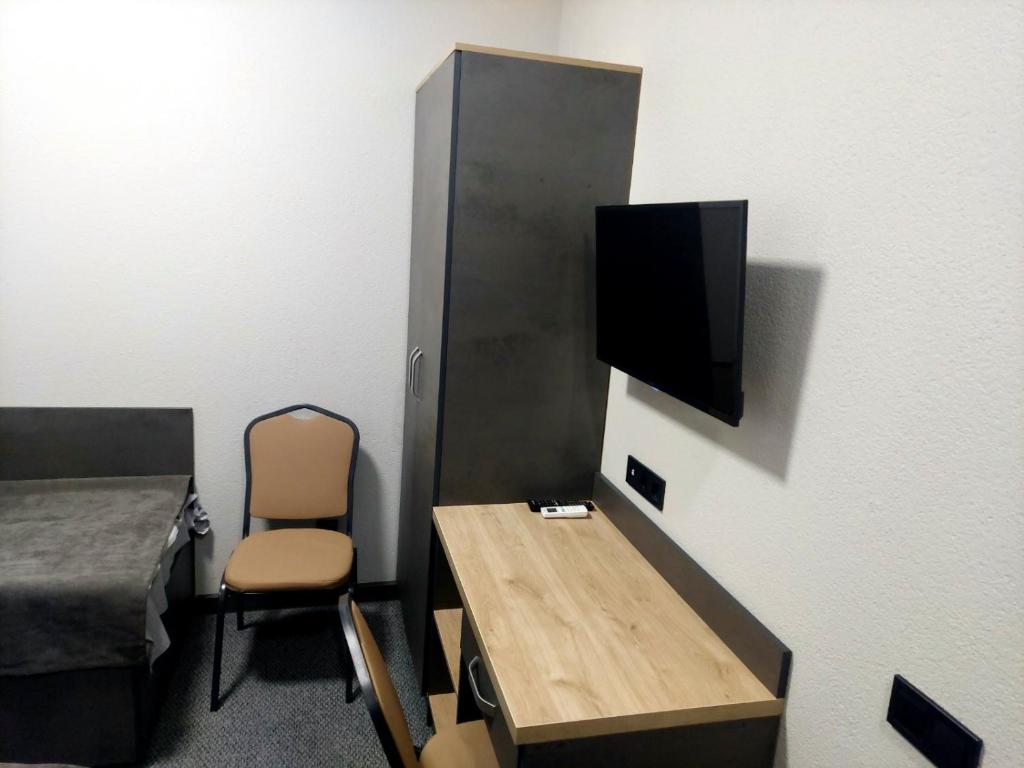 TV a/nebo společenská místnost v ubytování Alfa