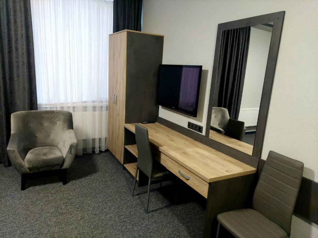 TV a/nebo společenská místnost v ubytování Alfa