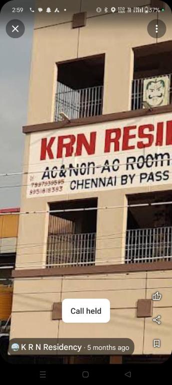 a building with a sign on the side of it at KRN Residency in Nagari