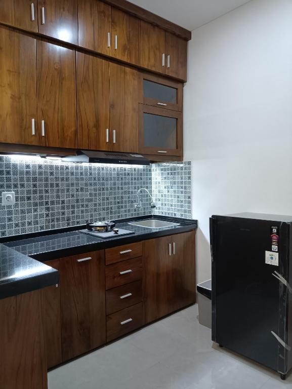 Kuchyň nebo kuchyňský kout v ubytování Rauda Living Space Syariah
