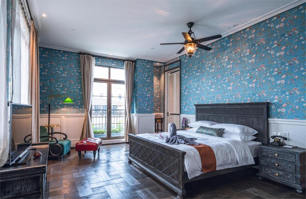 Postel nebo postele na pokoji v ubytování Guangzhou Nansha Stone Inn
