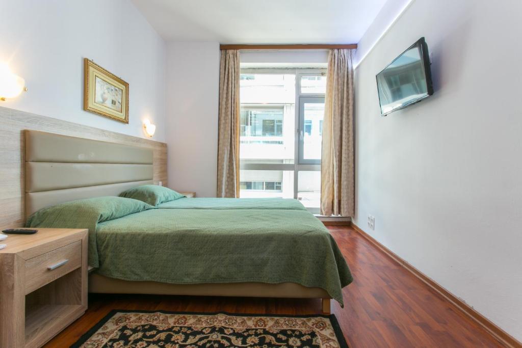 Posteľ alebo postele v izbe v ubytovaní Arethusa Hotel Athens