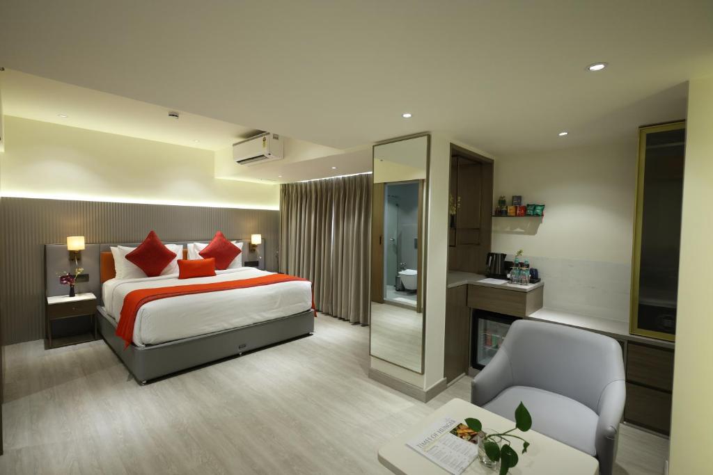 Postel nebo postele na pokoji v ubytování MARIGOLD-Newly Renovated Hotel