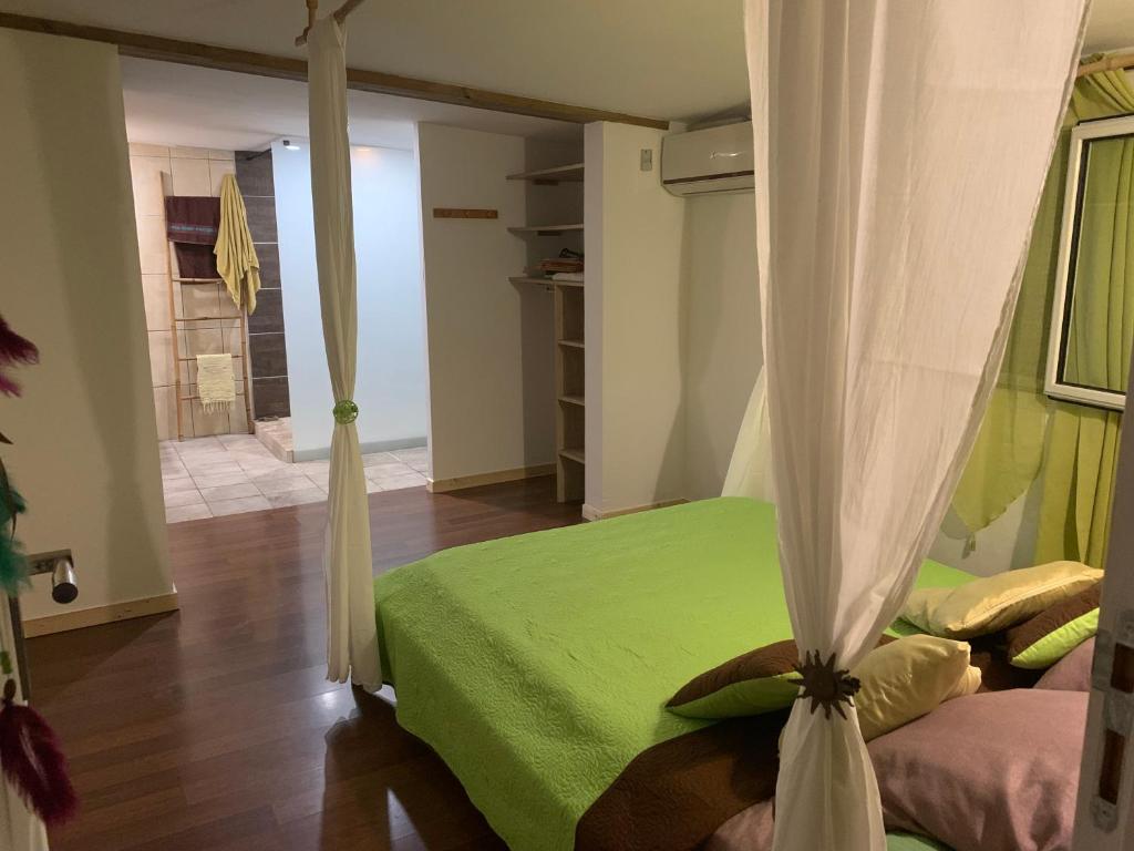 Postel nebo postele na pokoji v ubytování Suite parentale