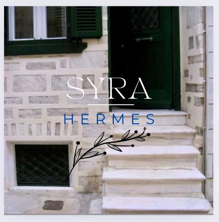 a green door with the words syra hermes at Syra & Hermes Home in Ermoupoli