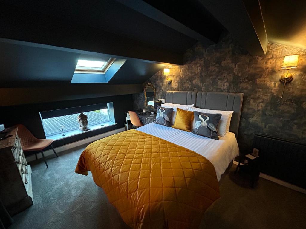 a bedroom with a large bed and a window at Aiskew Villa Annex in Bedale