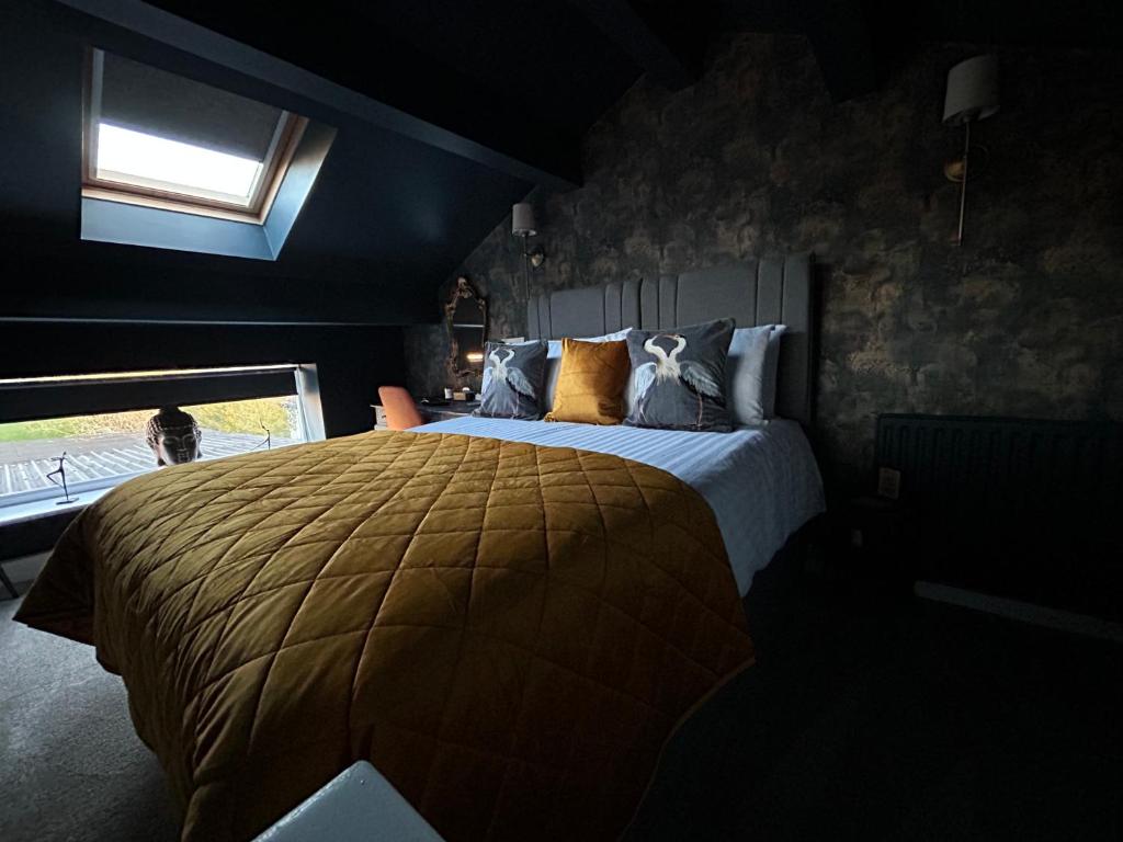 a bedroom with a large bed and a window at Aiskew Villa Annex in Bedale