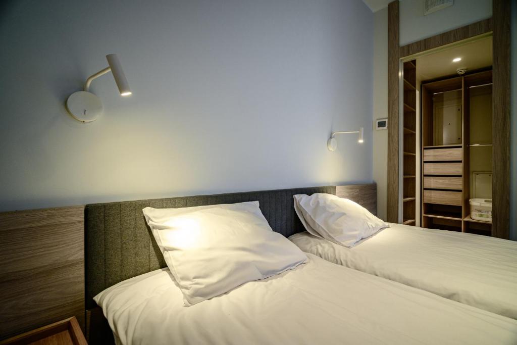 Postel nebo postele na pokoji v ubytování LURICH Residences