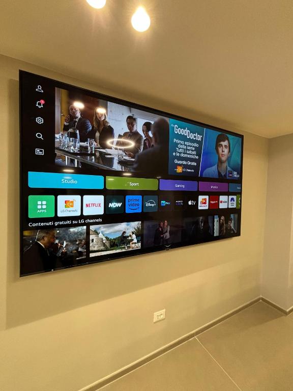 TV a/nebo společenská místnost v ubytování Hotel Valle Rossa