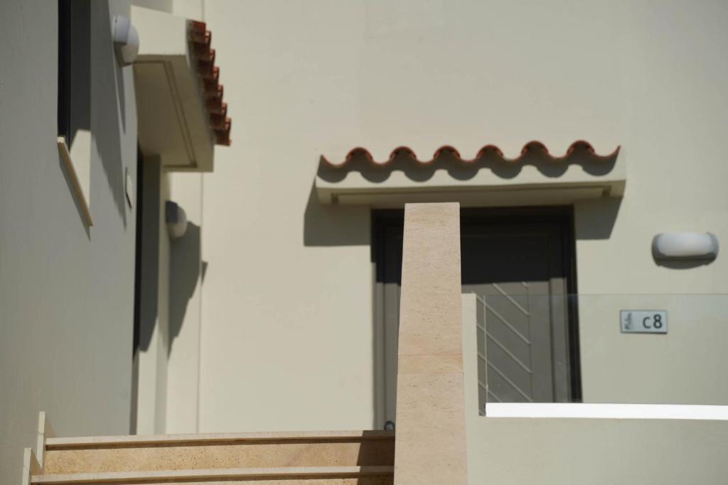 a side view of a building with a window at Malena Hotel & Suites - Adults Only by Omilos Hotels in Amoudara Herakliou