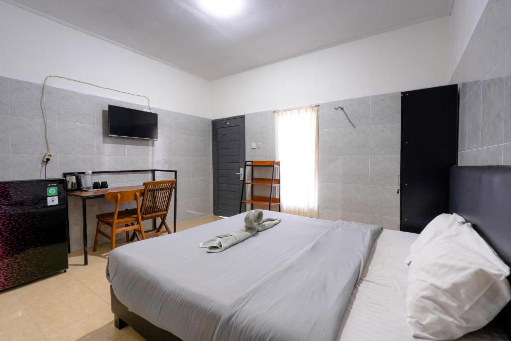 Postel nebo postele na pokoji v ubytování Urbanview Ava Guest House Goa Gong