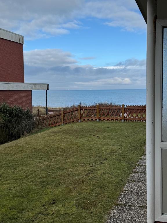 a view of the ocean from the porch of a house at Poseidon 1 6 in Wangerooge