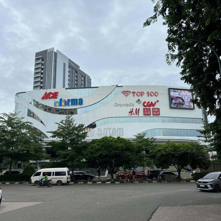 a large building with a sign on the side of it at Casabella 106 BCS A2 Grand Batam Penuin Wet Market in Nagoya