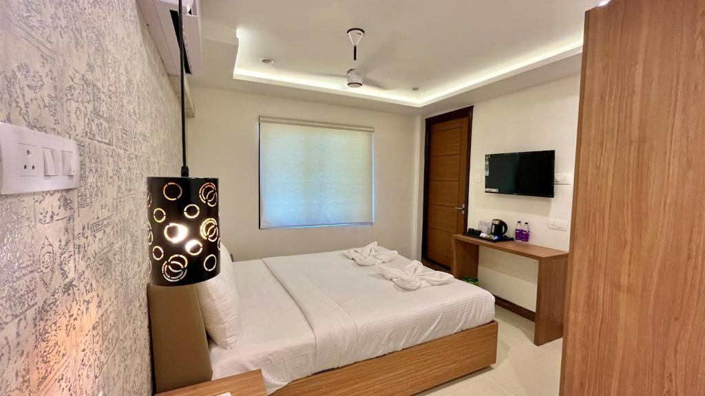 Postel nebo postele na pokoji v ubytování Hotel Pearl Palace