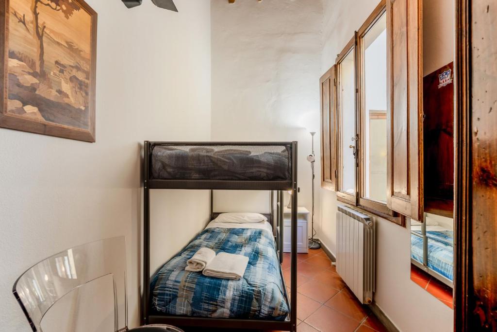 Posteľ alebo postele v izbe v ubytovaní Heart of Florence - San Lorenzo Lovely Apartment