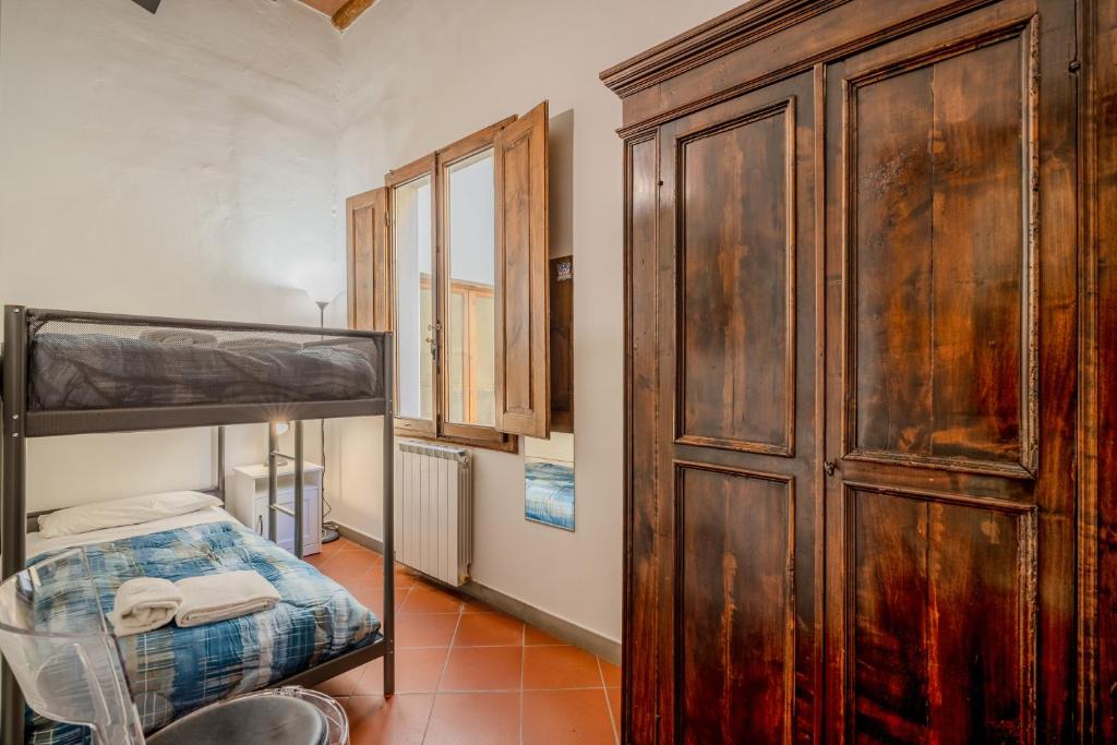 Posteľ alebo postele v izbe v ubytovaní Heart of Florence - San Lorenzo Lovely Apartment