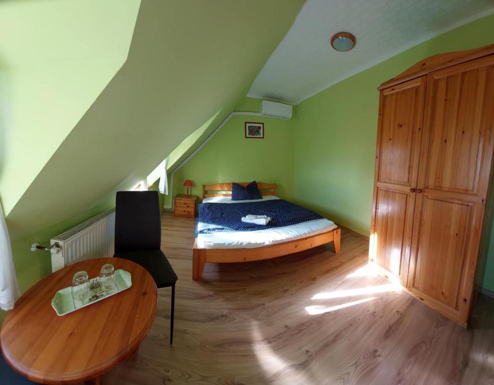 Postel nebo postele na pokoji v ubytování Diána Fogadó