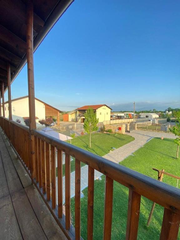 a balcony with a view of a park at La Maison du Coq in Passatore