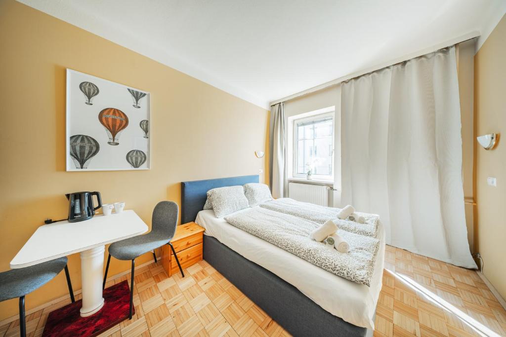 Postel nebo postele na pokoji v ubytování Vienna West Rooms