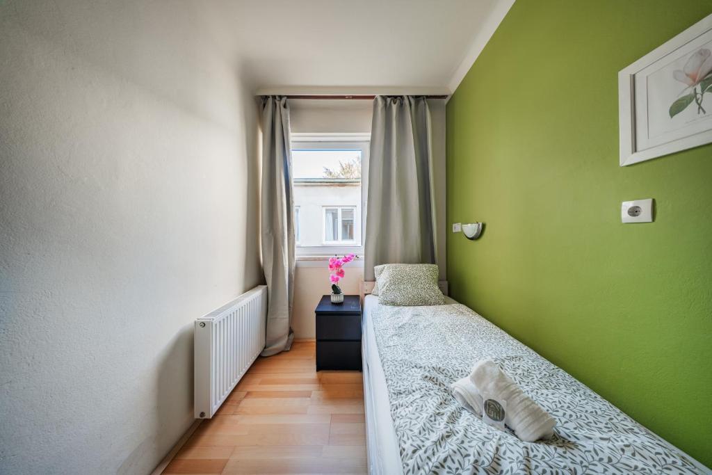 Postel nebo postele na pokoji v ubytování Vienna West Rooms