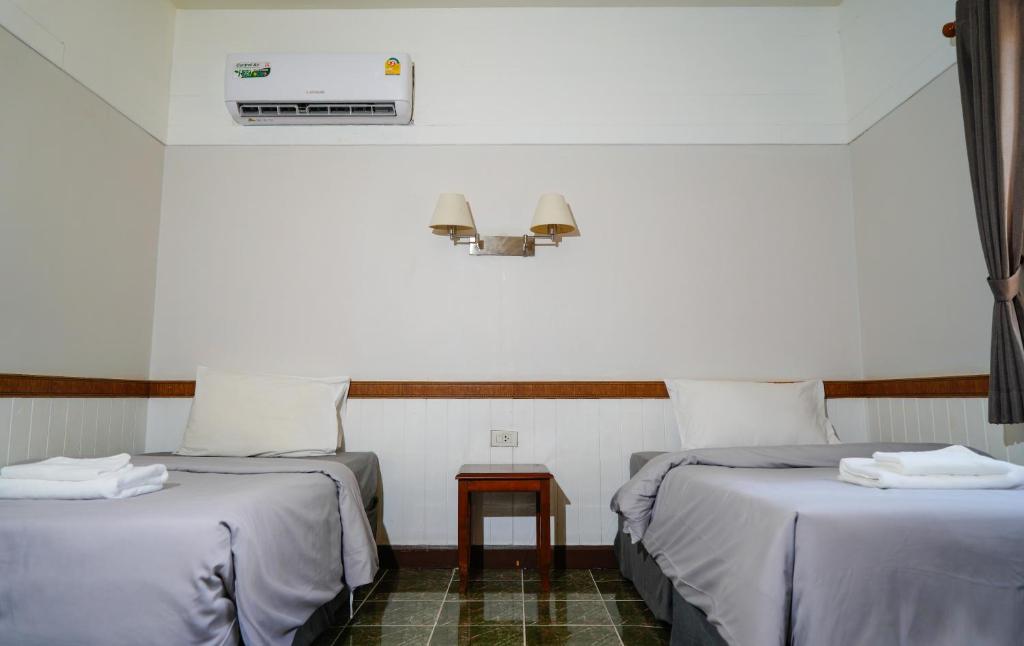 Postel nebo postele na pokoji v ubytování Luna Hut Resort