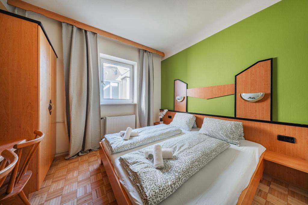 Postel nebo postele na pokoji v ubytování Vienna West Business Inn