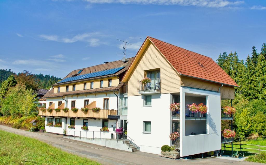 a building with solar panels on the roof at Landhotel Karin in Freudenstadt