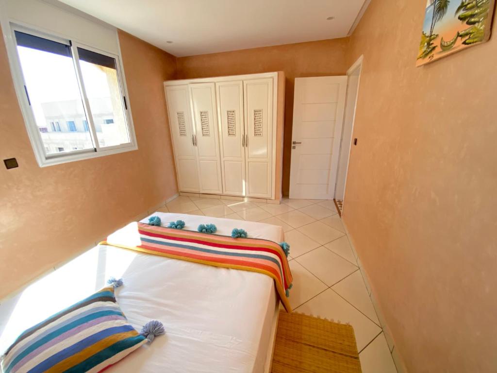 Een bed of bedden in een kamer bij Tawada