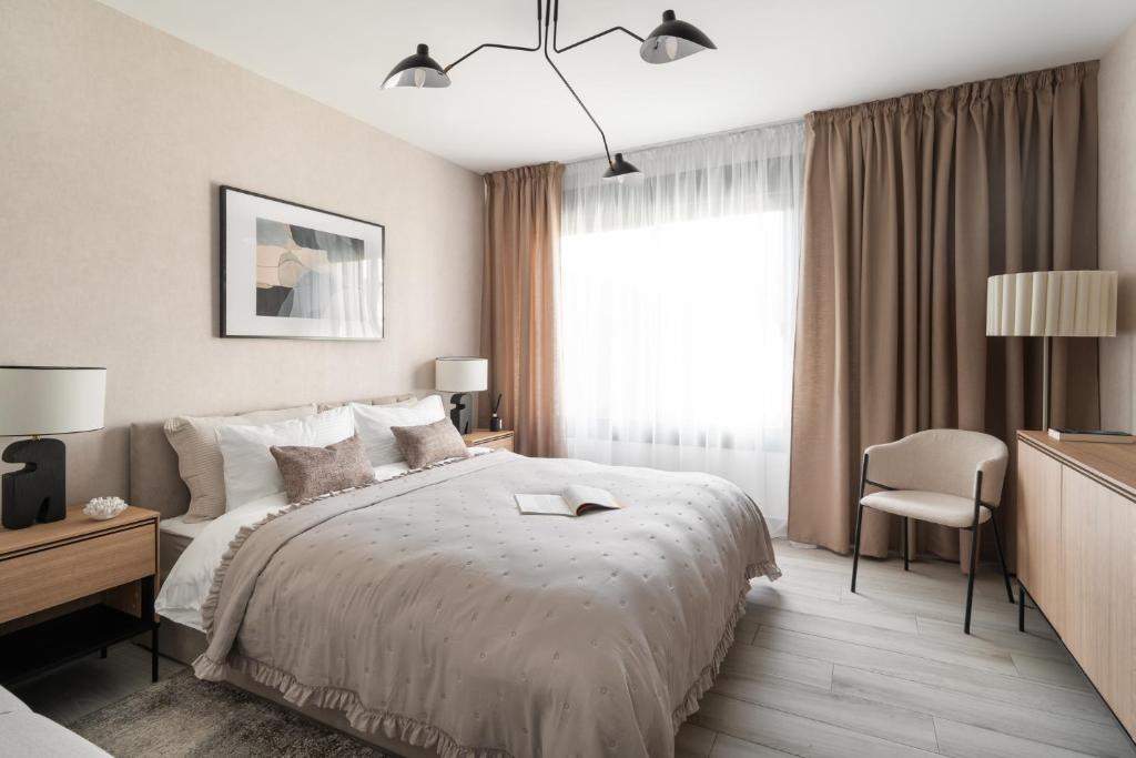 a bedroom with a bed and a desk and a window at Casa Elegante Casares Costa Golf in Casares