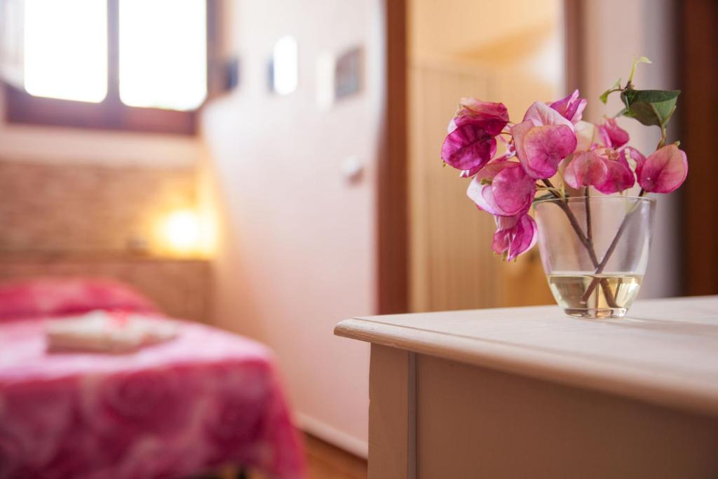 Postel nebo postele na pokoji v ubytování villa amodeo