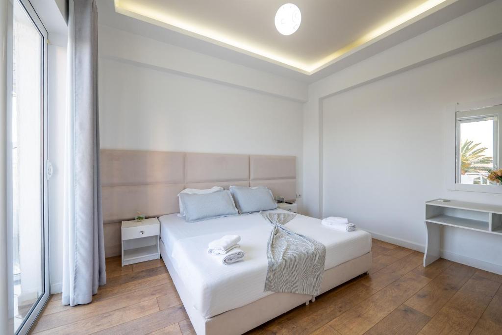 Postel nebo postele na pokoji v ubytování Hotel Myrtai - City Center