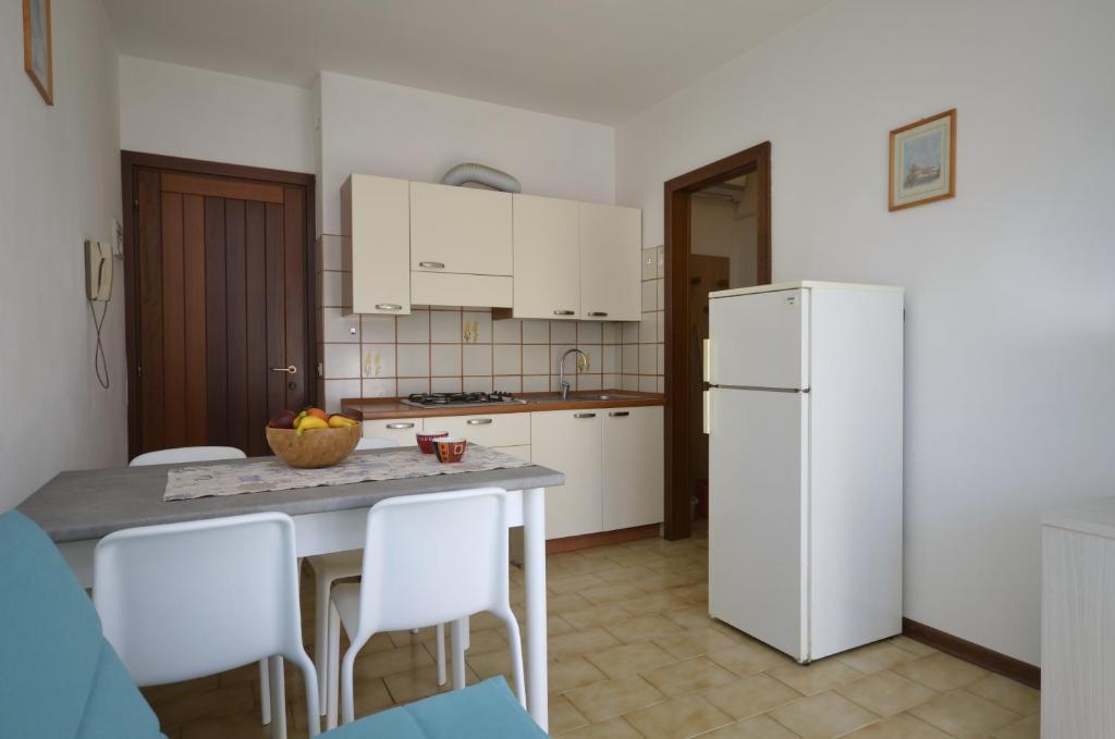 Kuchyňa alebo kuchynka v ubytovaní Condominio Fenice