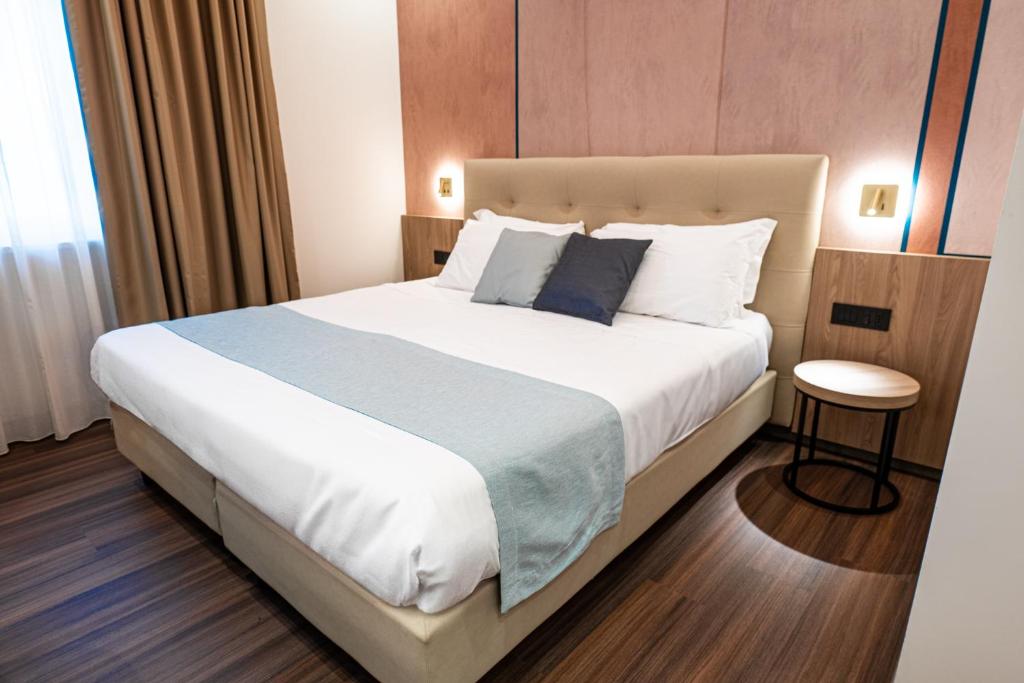 Postel nebo postele na pokoji v ubytování Hotel Vittoria
