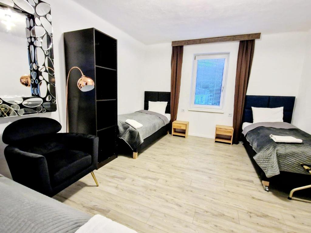 Postel nebo postele na pokoji v ubytování Tiny Apartments 07 am Viehofner See