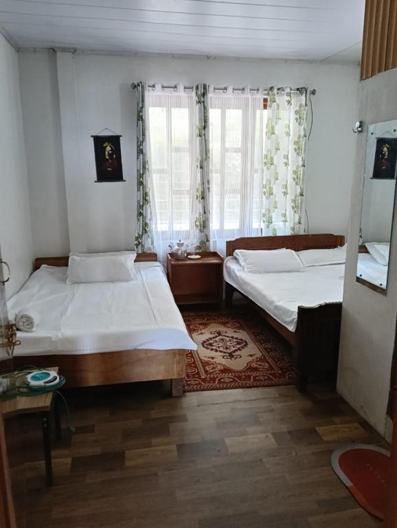 Postel nebo postele na pokoji v ubytování Yuven House