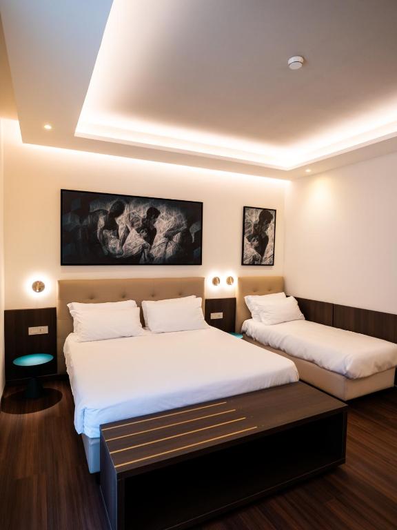 Postel nebo postele na pokoji v ubytování Hotel Vittoria