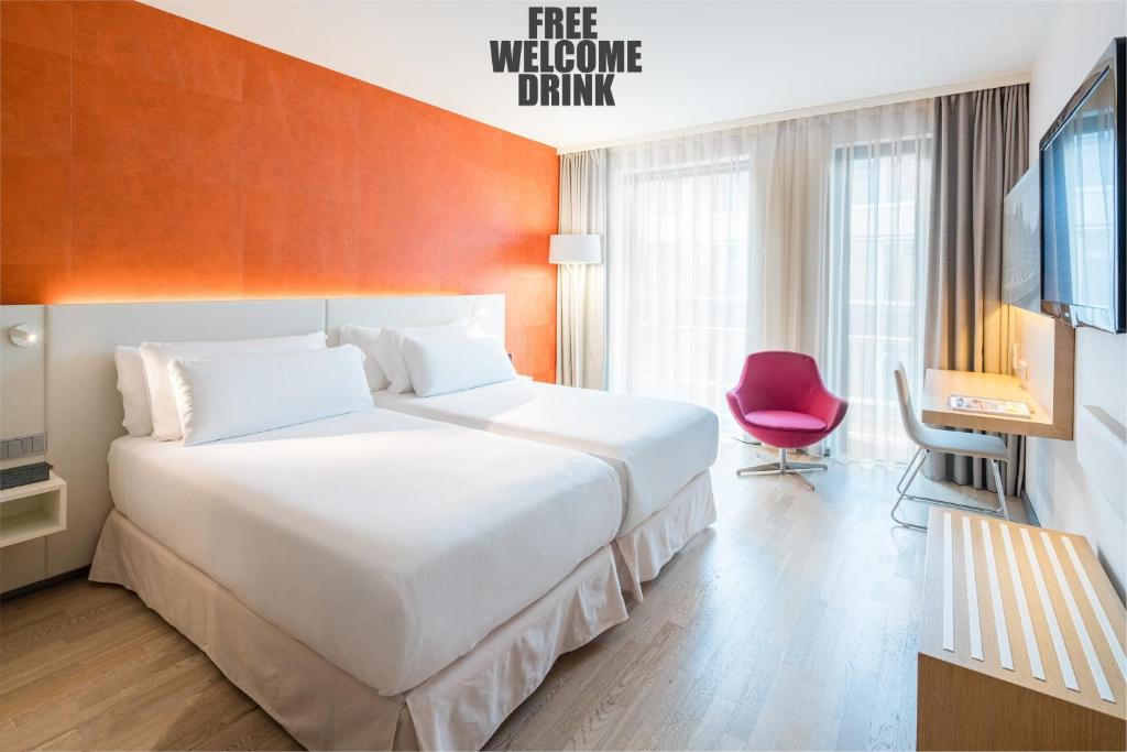 Postel nebo postele na pokoji v ubytování Barceló Hamburg