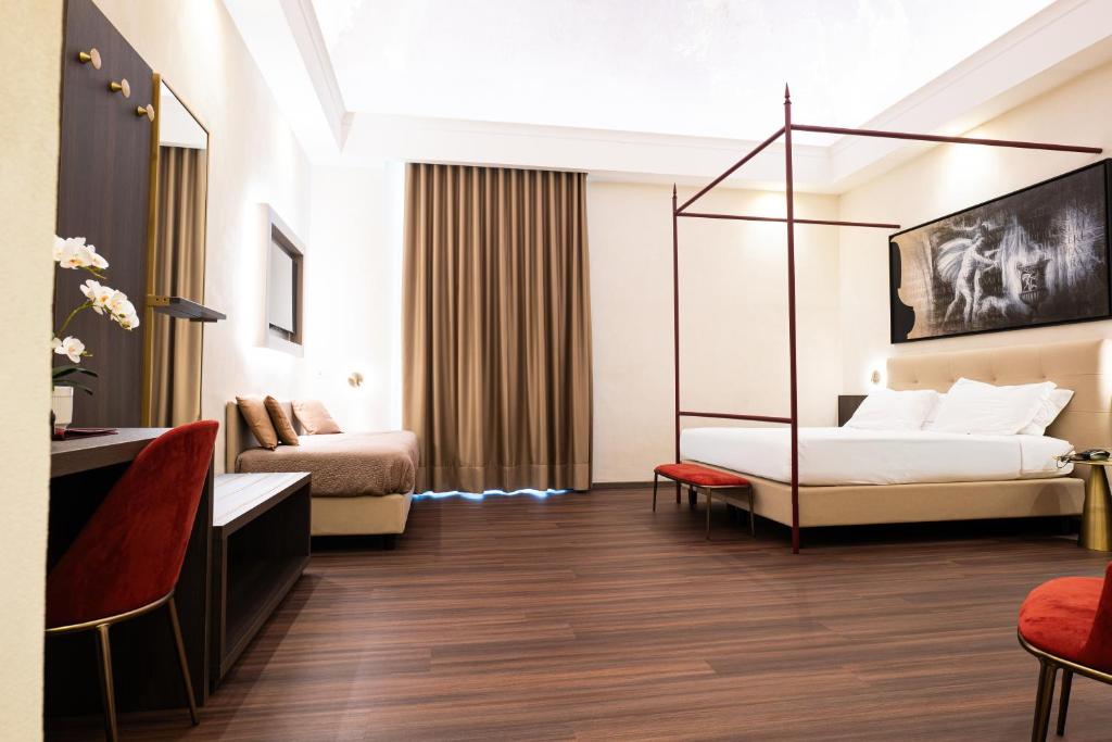 Postel nebo postele na pokoji v ubytování Hotel Vittoria